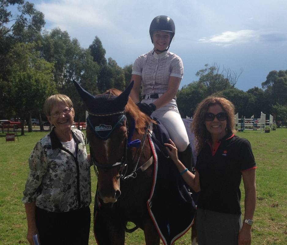 LH Johnny standing proudly with the rug and ribbon and Anne-Marie a NAB rep and judge Anne Garner